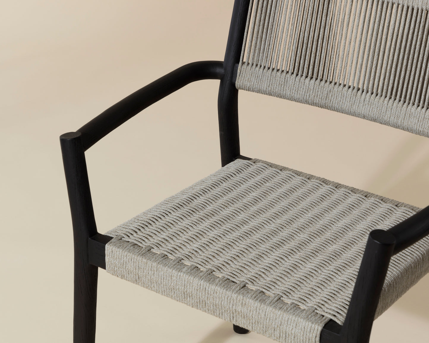 NAHLA KAVALA STACKABLE DINING ARMCHAIR - CHARCOAL