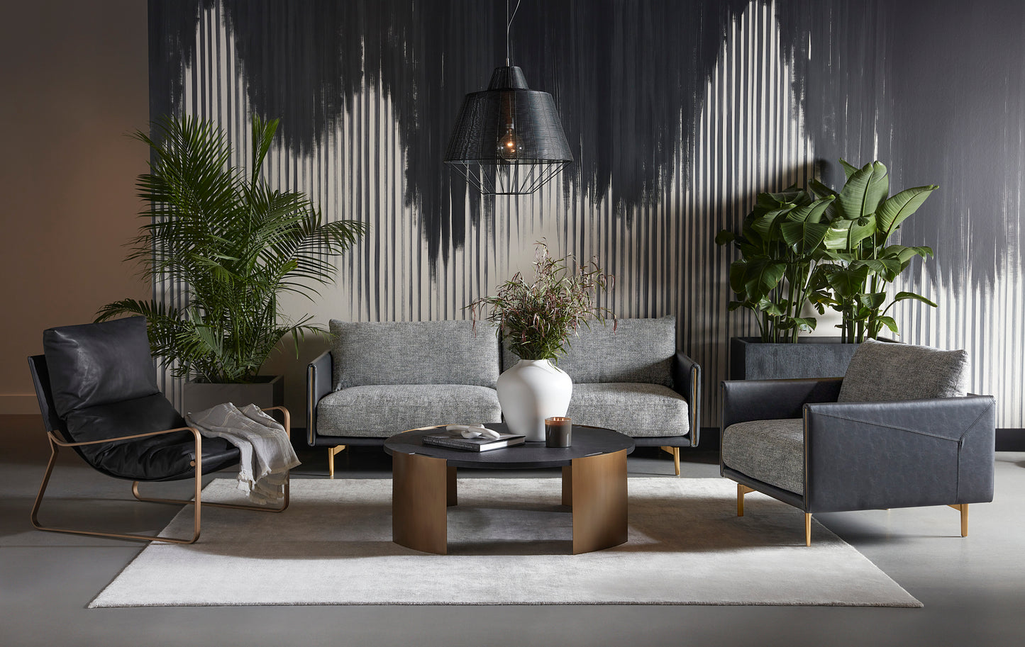 NAHLA ZANCOR LOUNGE CHAIR - ANTIQUE BRASS - CHARCOAL BLACK LEATHER